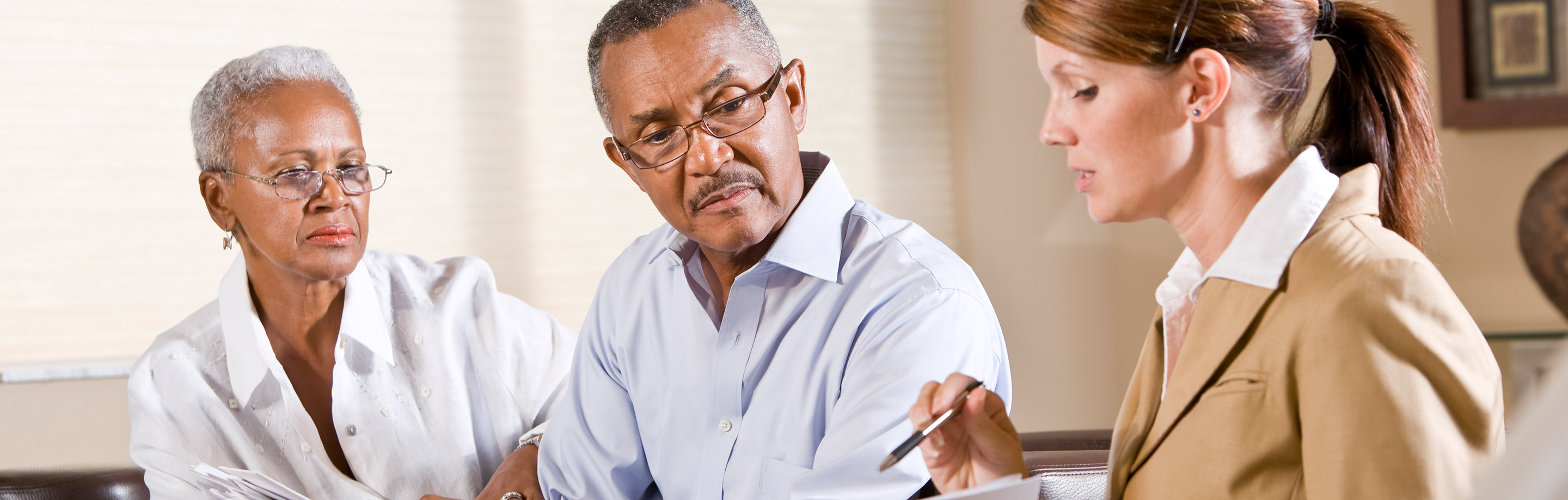 Older African American couple meet with financial planner