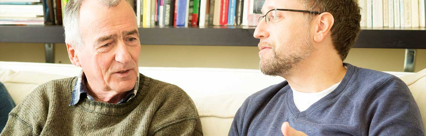 father and son discussing finances