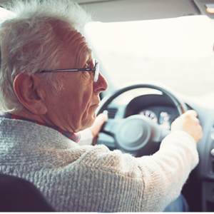 older adult man driving